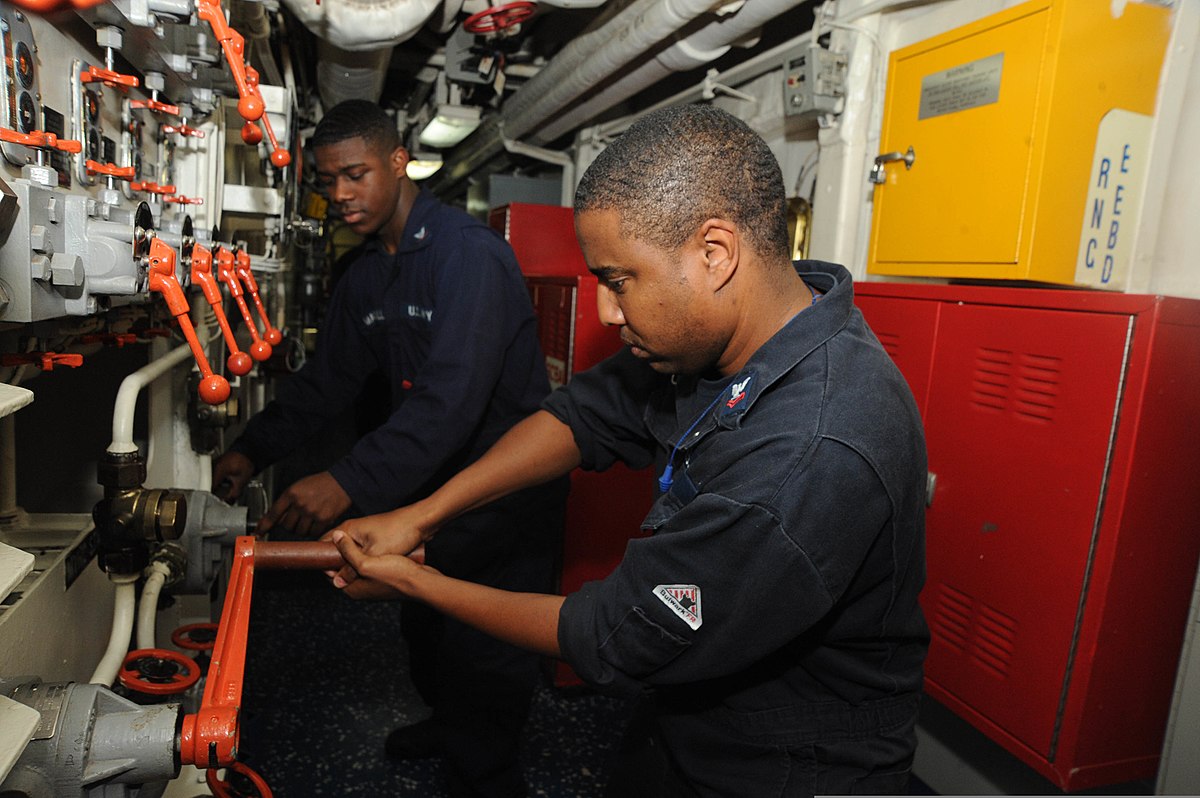 Chelvis “CJ” Marshall aligning a main space eductor aboard USS Hue City.