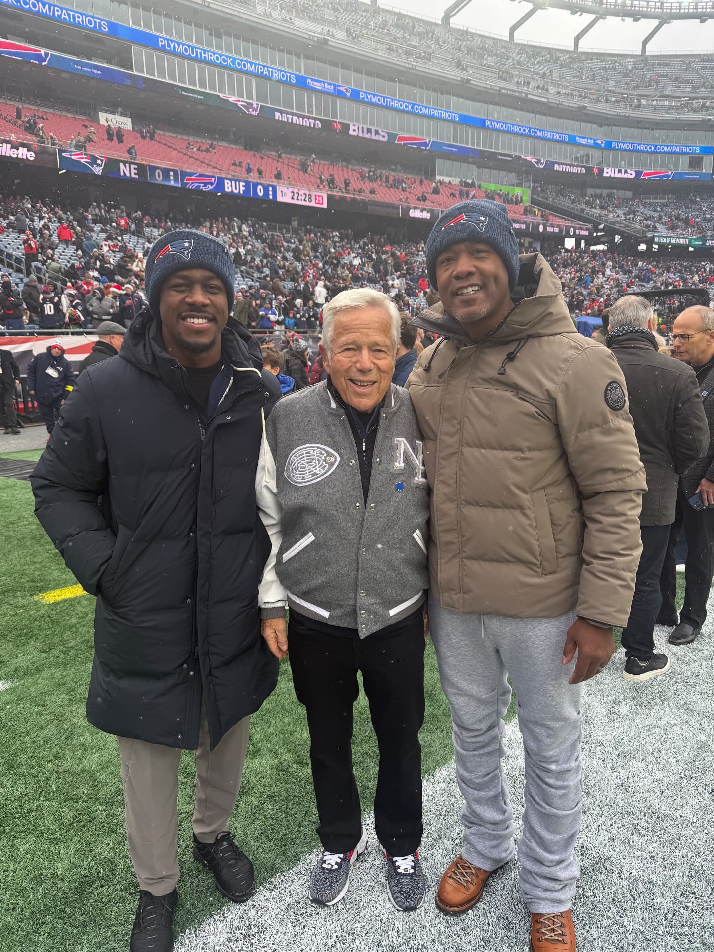 Chelvis “CJ” Marshall with Robert Kraft and Lawyer Milloy at Gillette Stadium.